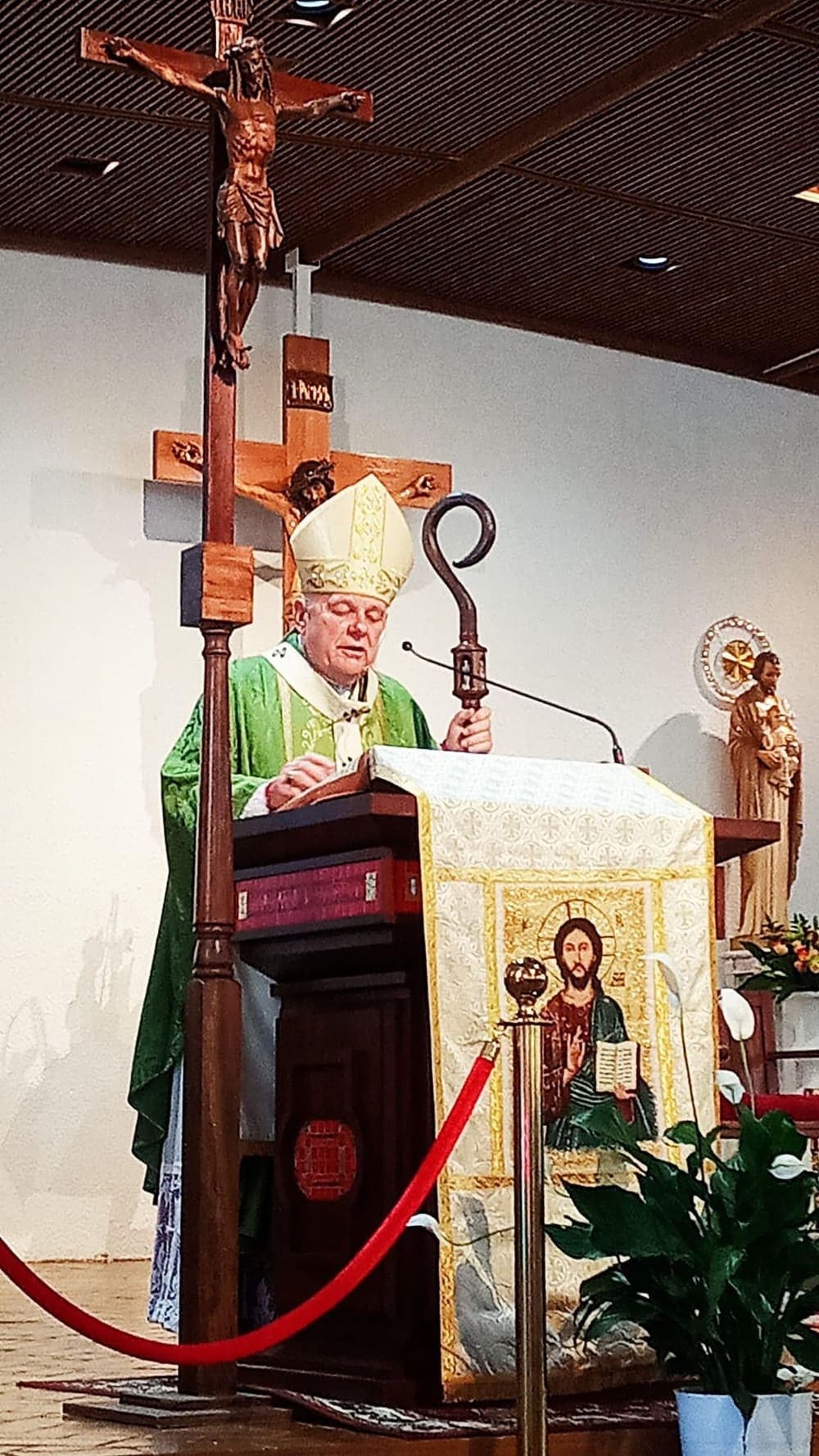A bishop at the ambo inside St. Lawrence Catholic Church